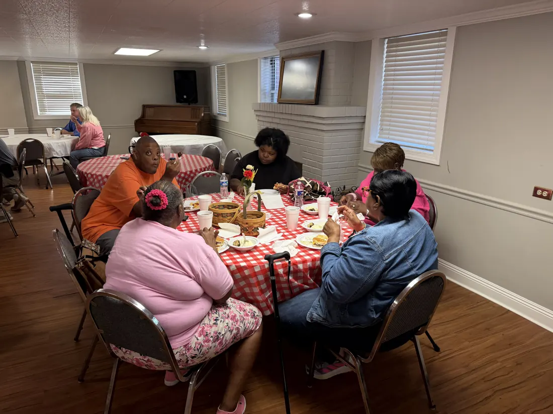 Friends sharing a meal at Woodville Baptist Church, photo 7
