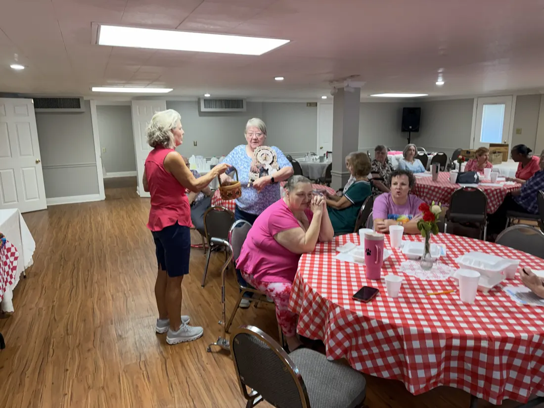 Friends sharing a meal at Woodville Baptist Church, photo 8