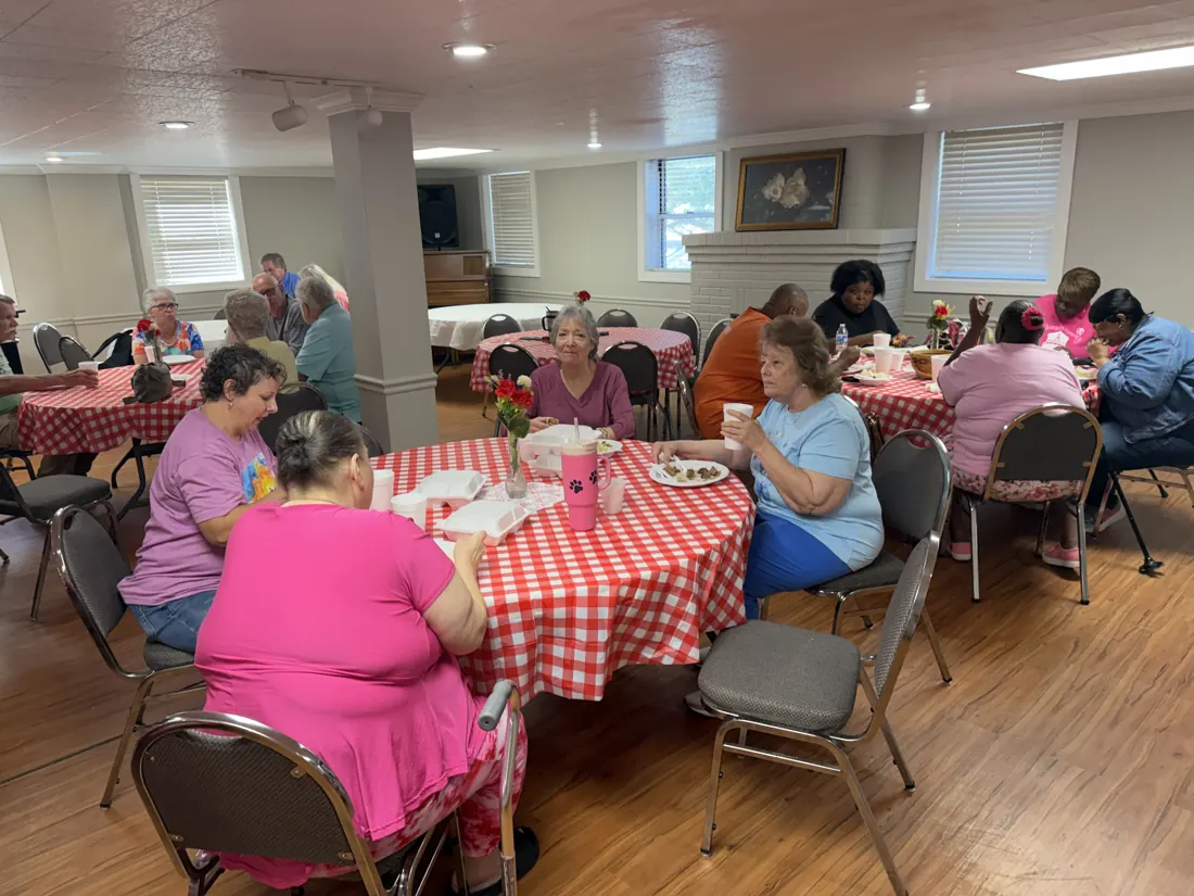 Friends sharing a meal at Woodville Baptist Church, photo 6